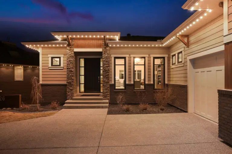 Warm white soffit lighting installed by Emerald Coast Illumination above a modern front entry