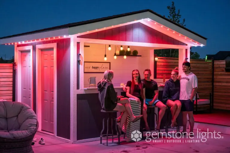 Permanent color-changing LED lights highlighting an outdoor bar and social area at night