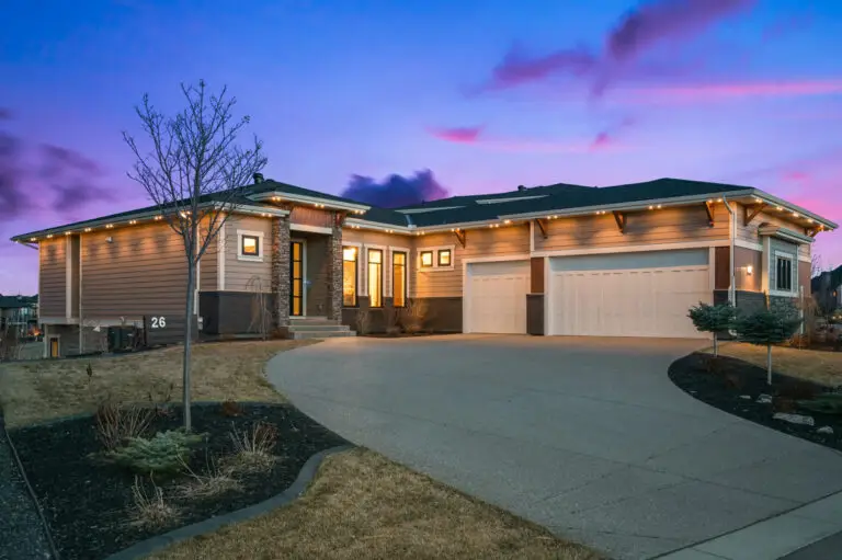 Gemstone Lights system illuminating a modern home with warm white soffit lighting at dusk