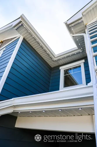 Permanent LED lights installed in soffit track of modern home