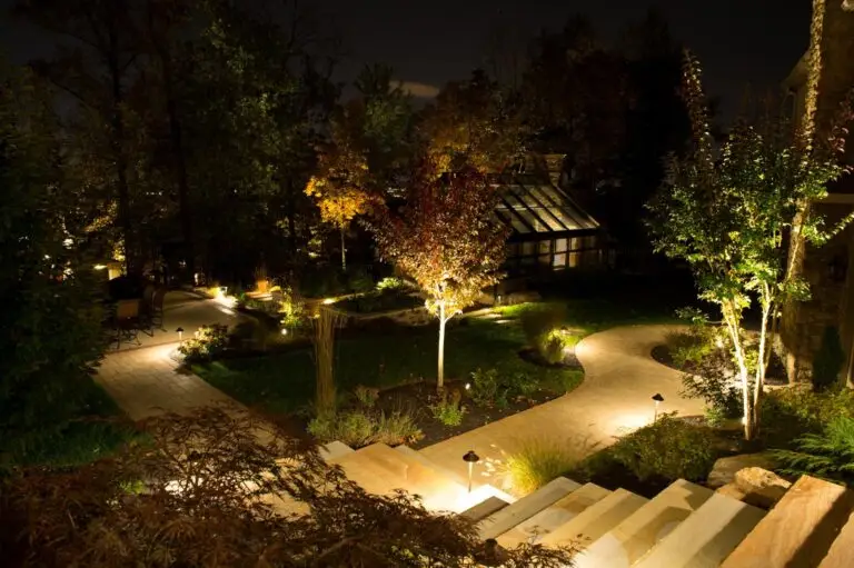 Close-up of FX Luminaire tiered path light in a landscaped yard