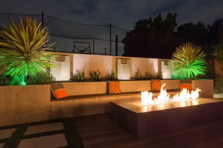 Contemporary Florida patio with fire pit, built-in seating, and accent lighting