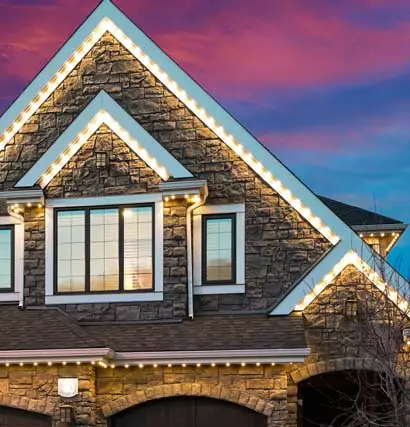 Permanent soffit LED lighting illuminating a Panama City home at night