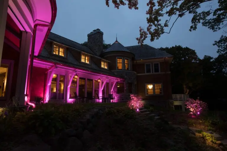 Custom outdoor lighting on a home exterior in vibrant pink tones, perfect for holidays, birthdays, or special occasions.